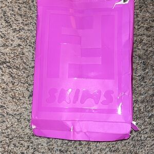 SKIMS Bold Pink Packaging